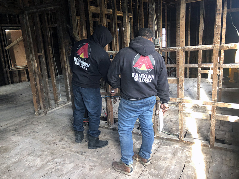 two beantown contractors in a gutted house